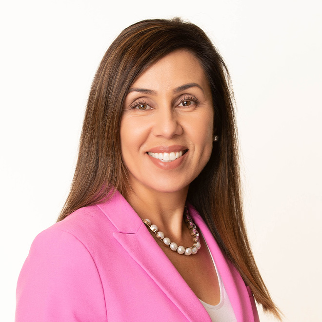 a woman in a pink suit