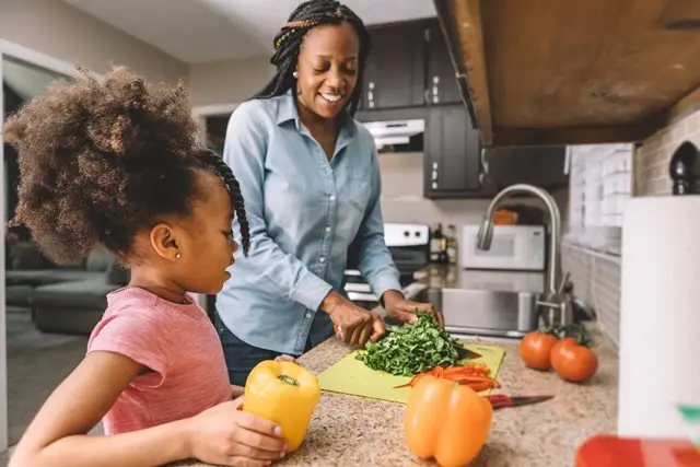 a-mother-and-child-chopping-veggies_small a-mother-and-child-chopping-veggies_small