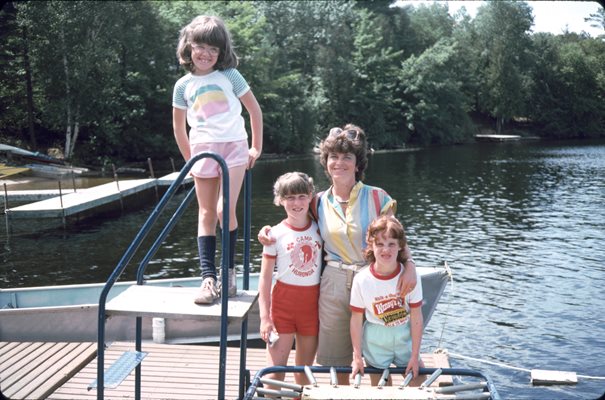 Children standing on a dock at camp
