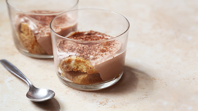 a glass of ice cream next to a glass of ice cream