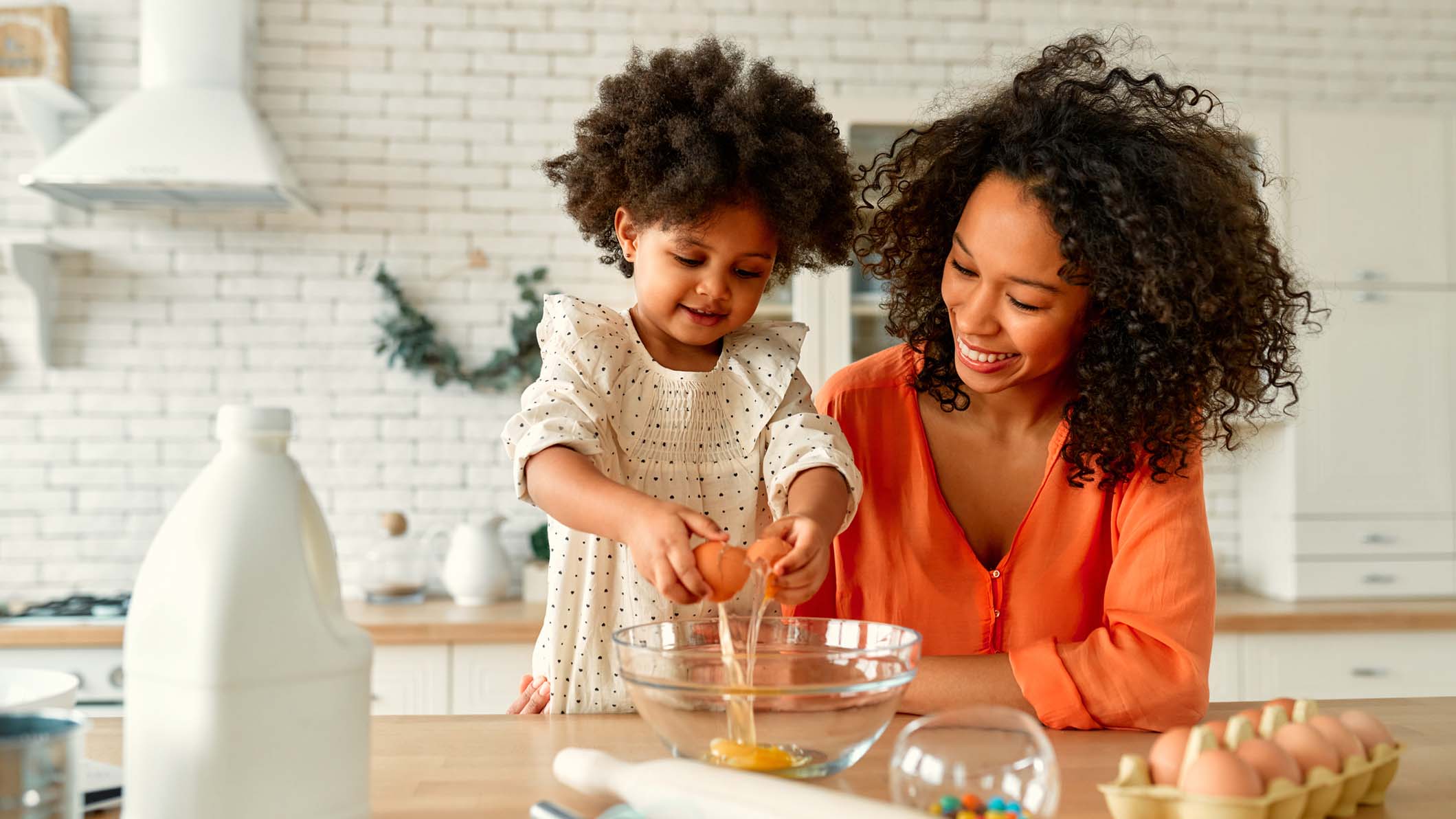 a person and a child making food