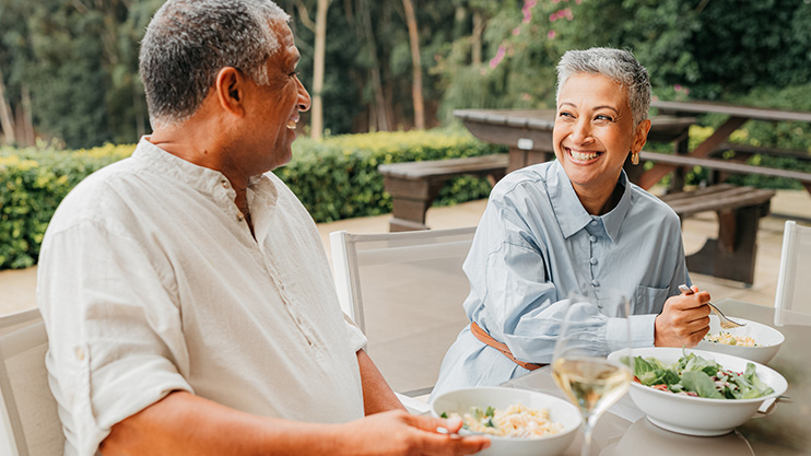 a man and a woman eating at a table