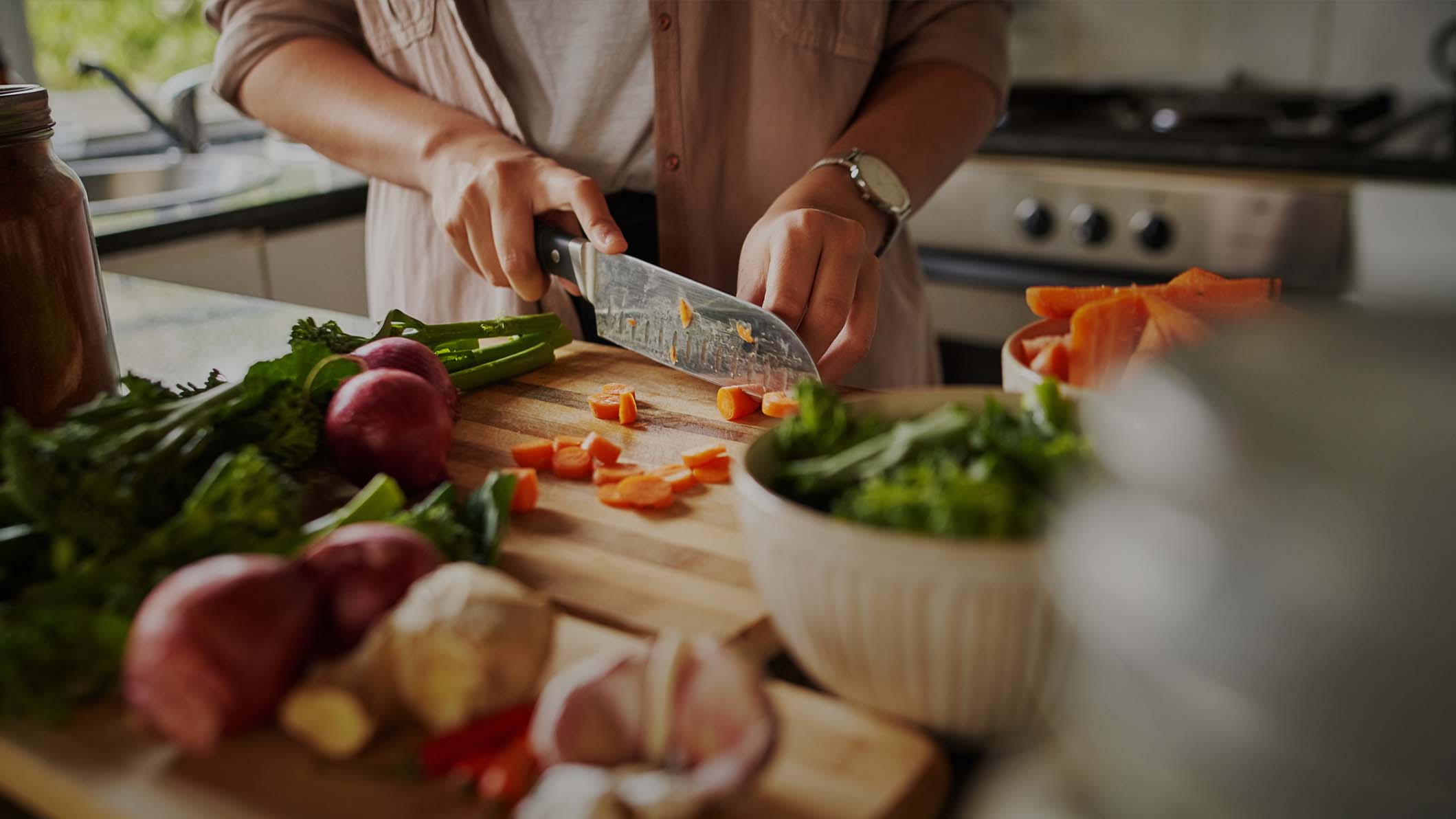 a person cutting vegetables